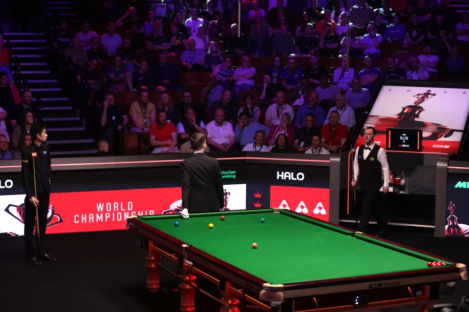 Mark Allen talks with Marcel Eckardt at the World Snooker Championship