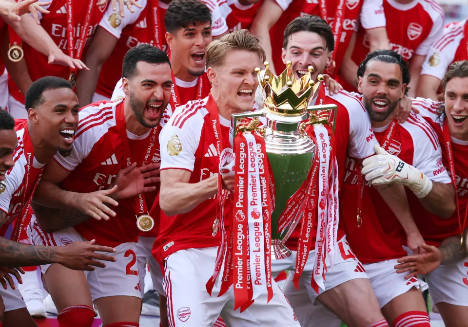Arsenal lifting the Premier League trophy