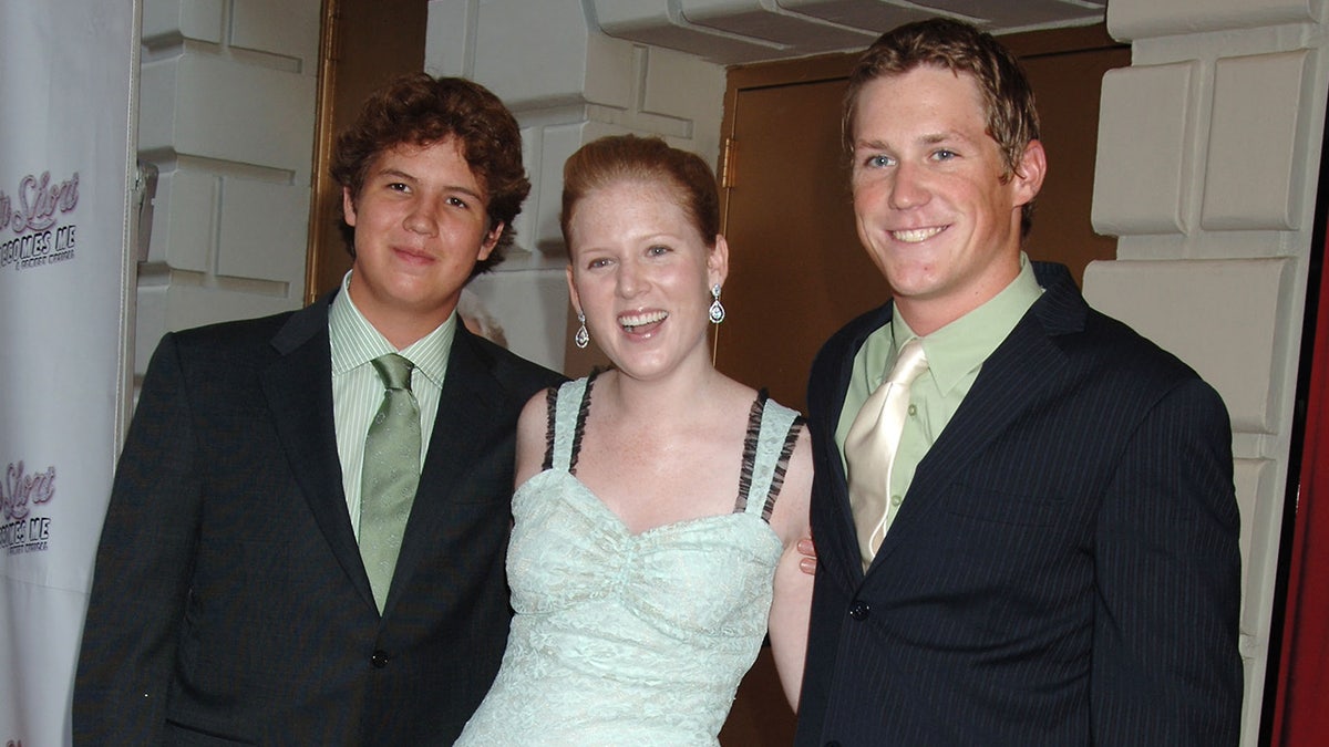Henry Short, Katherine Short and Oliver Short posing on red carpet at Broadway opening night