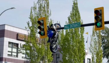 A Driver Turned And Couldn't See. Then A Motorcyce Ended Up Dangling From A Traffic Light Pole