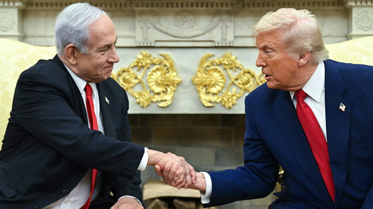 Israeli Prime Minister Benjamin Netanyahu shakes hands with President Donald Trump