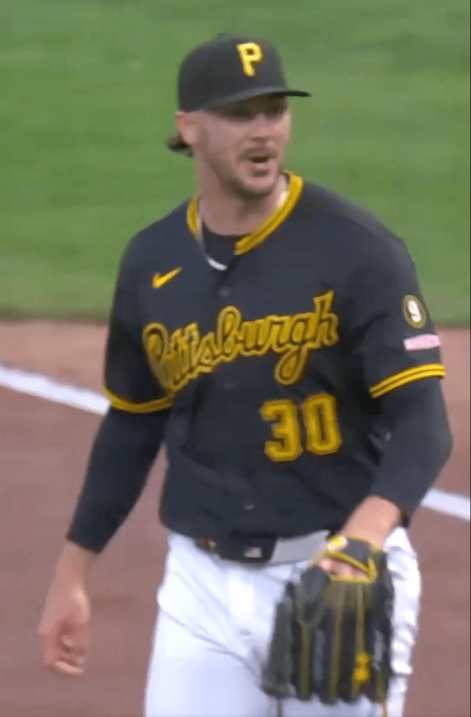 Paul Skenes in his Pittsburgh Pirates uniform, wearing a black cap and jersey with the number 30.