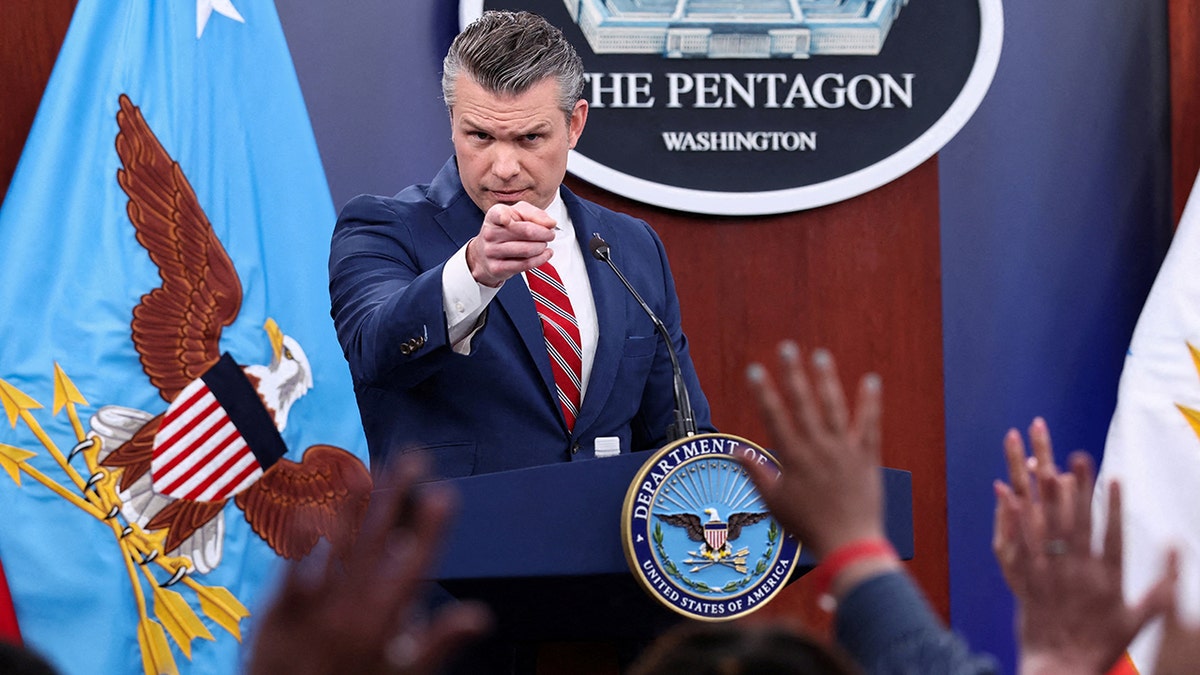Secretary of Defense Pete Hegseth speaking at a briefing inside the Pentagon