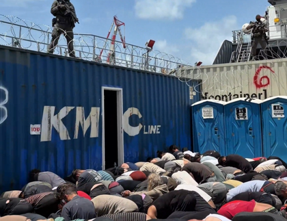 Armed Border Police officers watch over detained Gaza-bound flotilla activists in a video shared by far-right National Security Minister Itamar Ben-Gvir on Wednesday.