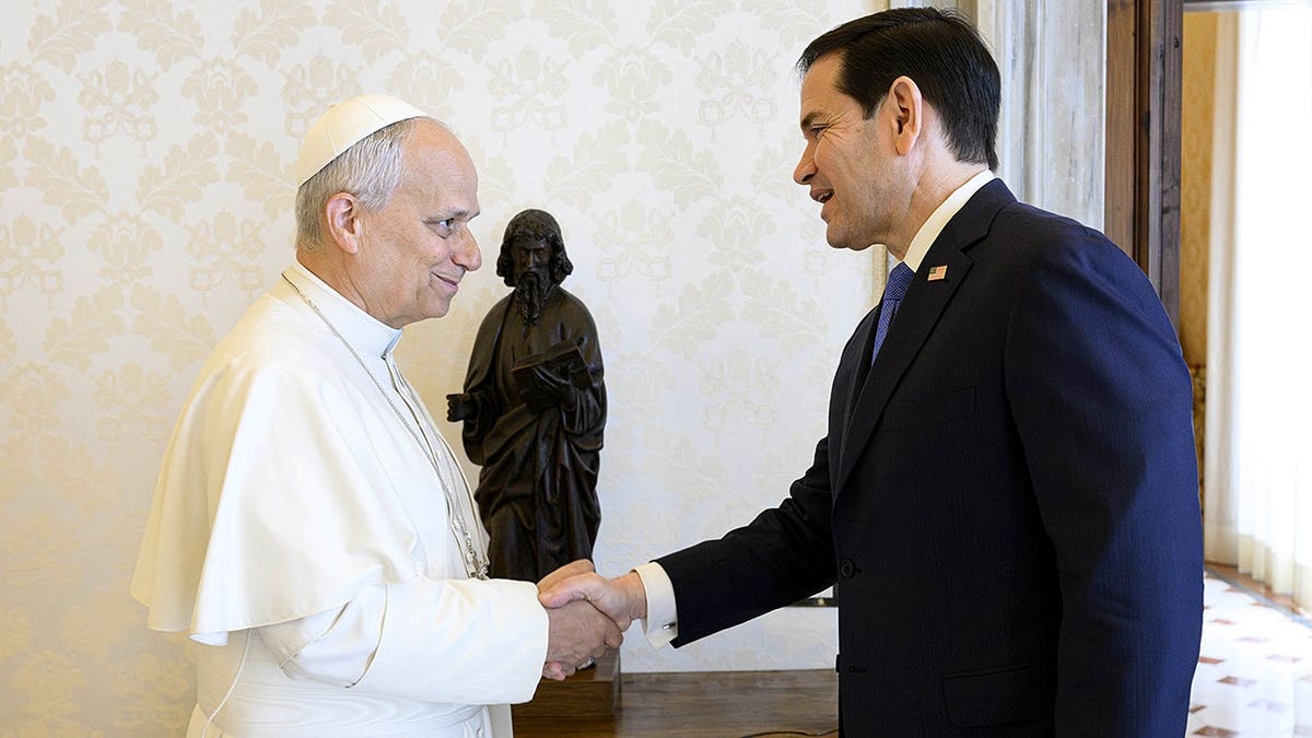 Pope Leo XIV and Marco Rubio shake hands