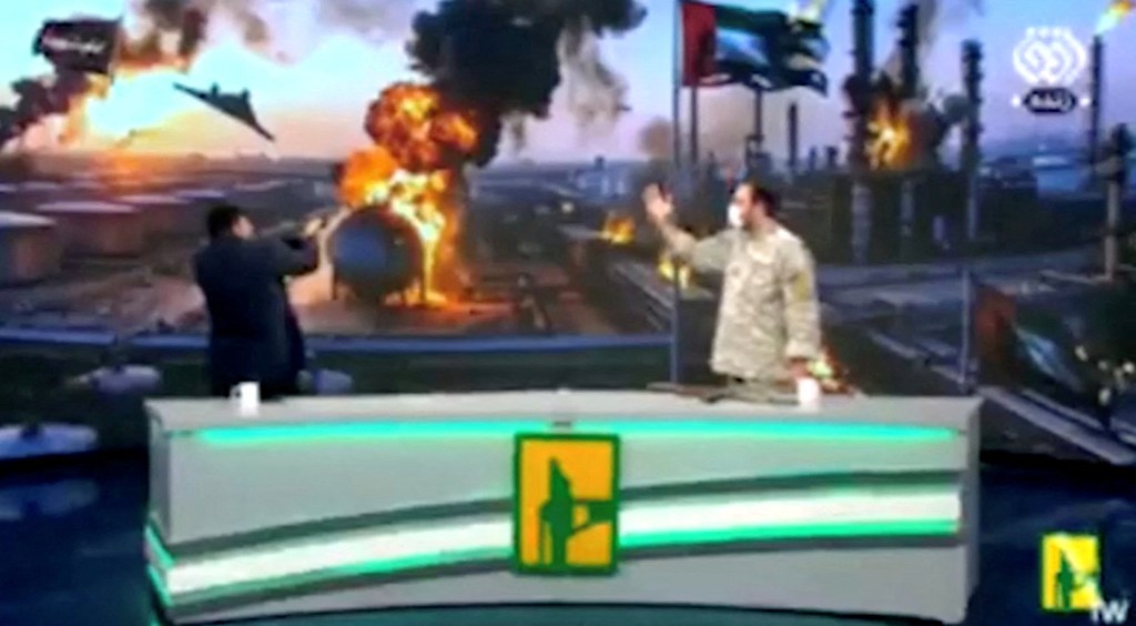 Mobina Nasiri, an Iranian state television news anchor, fires an assault rifle in the studio during a broadcast.