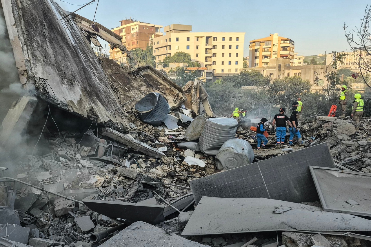 First responders search the rubble for victims at the site of an Israeli airstrike in the southern town of Nabatieh, Lebanon, Saturday. (AFP-Yonhap)