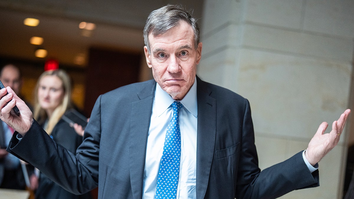 Sen. Mark Warner walking into the Capitol Visitor Center.