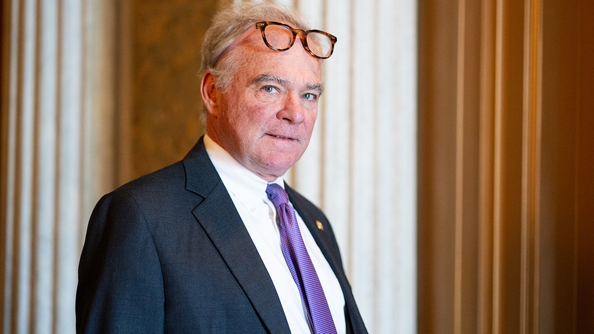 Sen. Tim Kaine walking away from the Senate floor in the U.S. Capitol