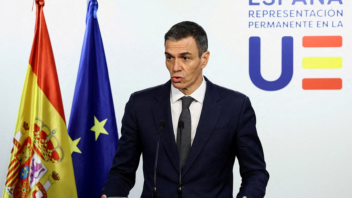 Spanish Prime Minister Pedro Sanchez speaking at a podium