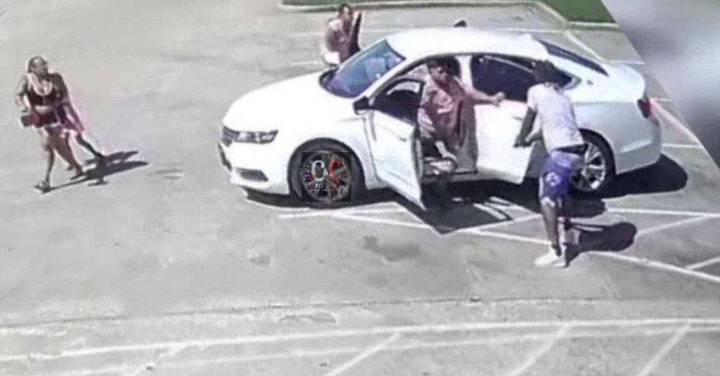 Screenshot of an attempted carjacking in a parking lot.