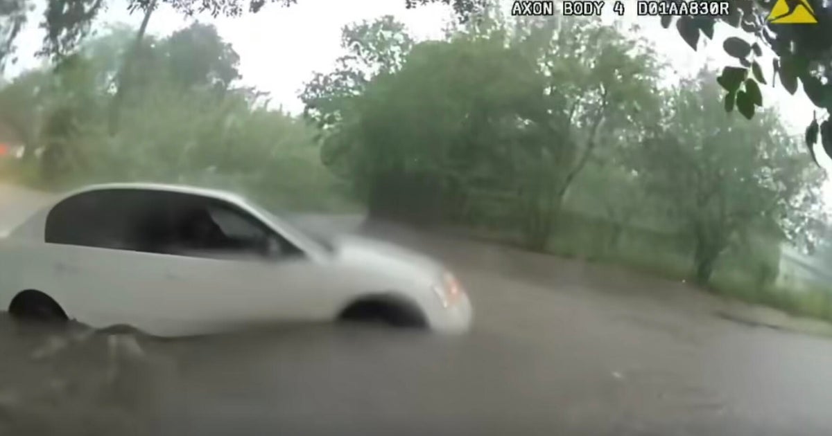Video shows infant being rescued from car trapped in Texas floodwaters