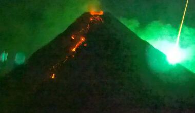 A Fiery Visitor From Space Photo-Bombs an Erupting Volcano