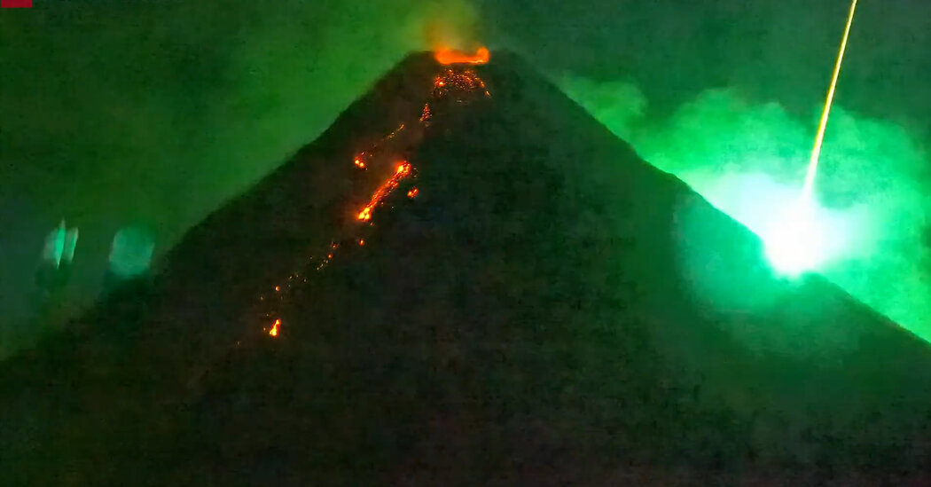 A Fiery Visitor From Space Photo-Bombs an Erupting Volcano