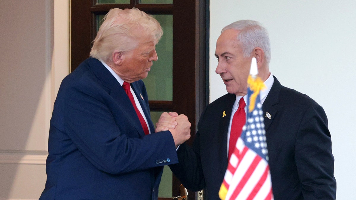 President Donald Trump waving goodbye to Israeli Prime Minister Benjamin Netanyahu outside the White House