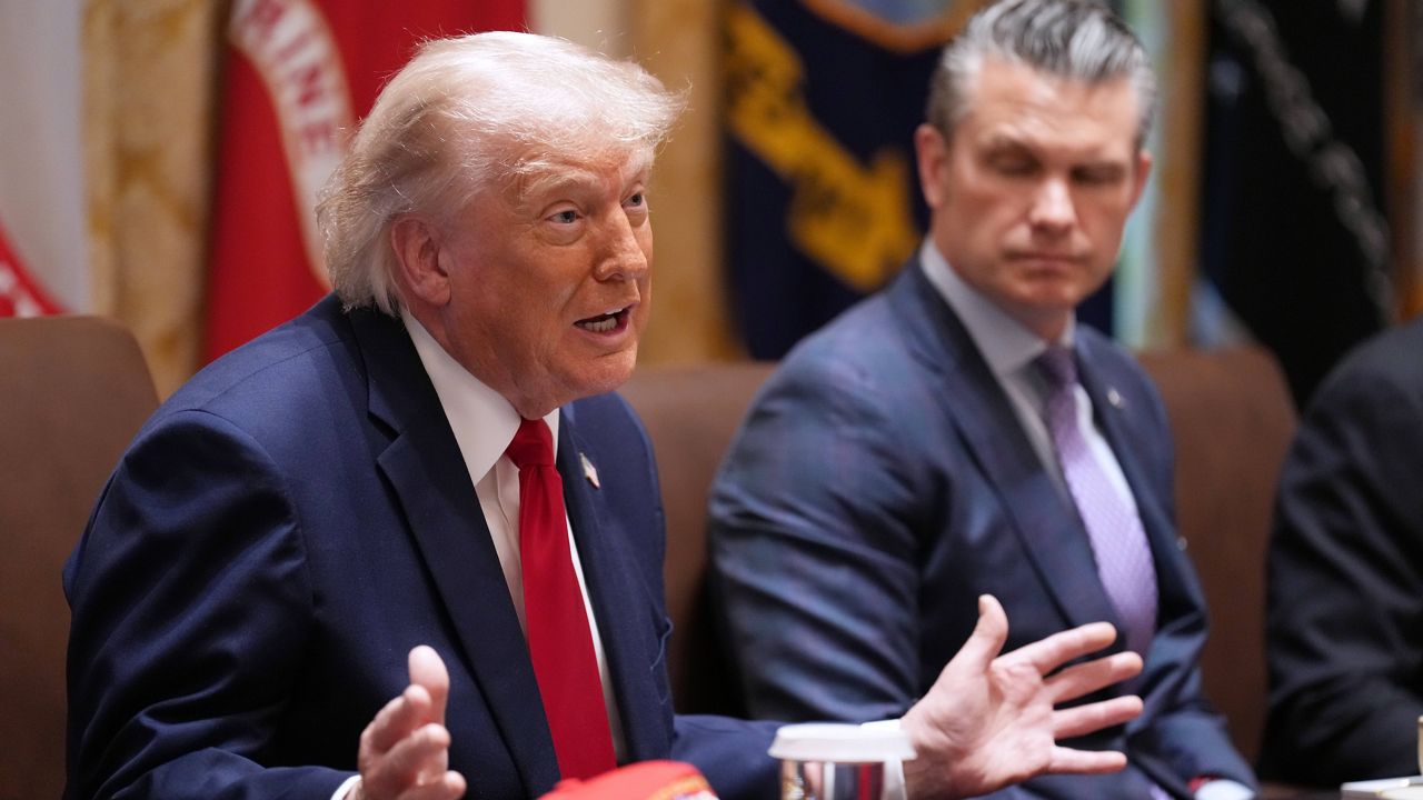 President Donald Trump speaks during a Cabinet meeting at the White House, Wednesday, May 27, 2026, in Washington, as Secretary of Defense Pete Hegseth, looks on. (AP Photo/Jacquelyn Martin)