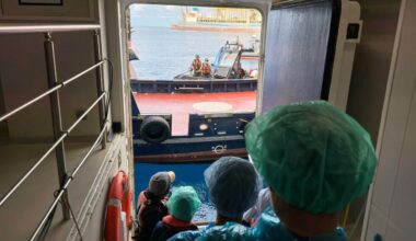 Passengers disembark from a hantavirus-stricken cruise ship, in photos