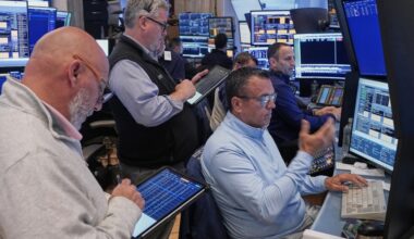 US stocks hover near records as oil slides on hopes of an Iran deal