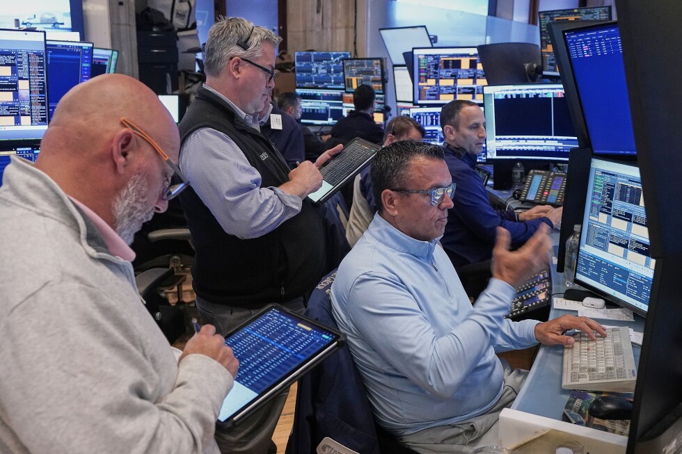 US stocks hover near records as oil slides on hopes of an Iran deal