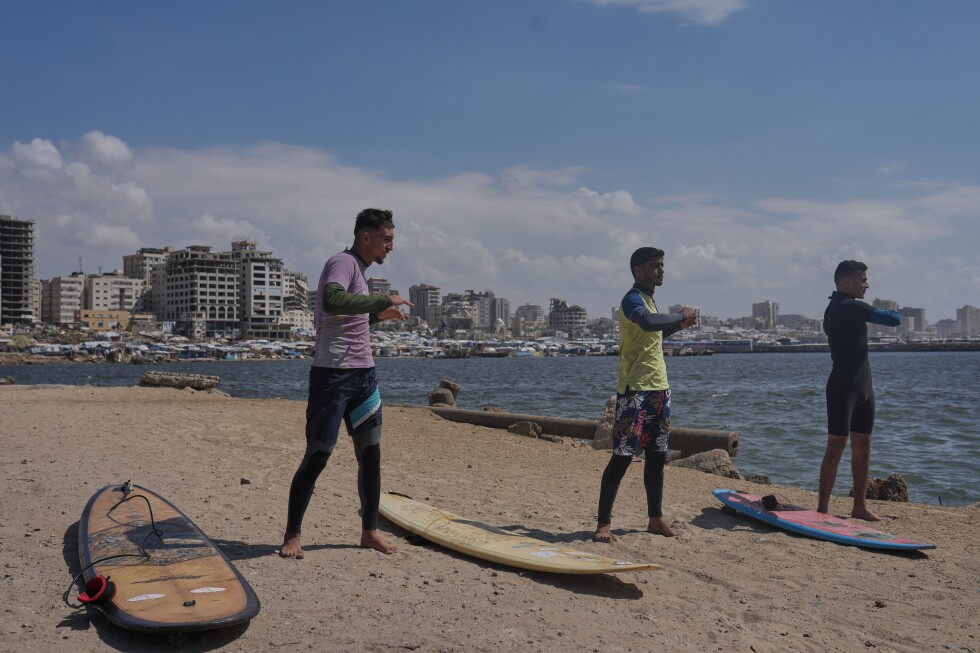 Palestinian surfers ride waves off Gaza coast despite risks