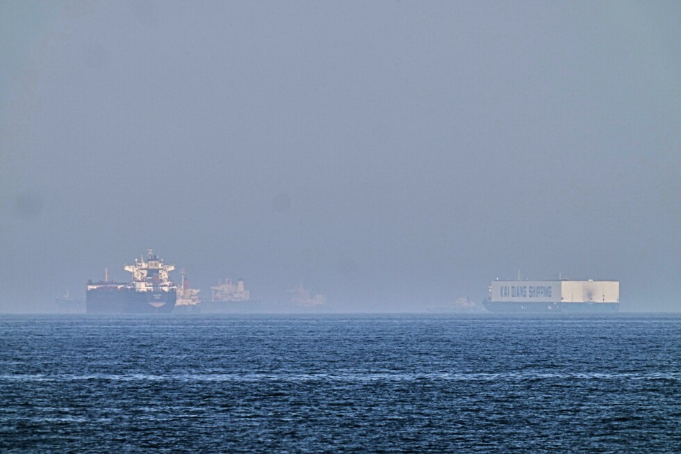 World shares are mixed and oil climbs as US tries to guide ships from the Strait of Hormuz