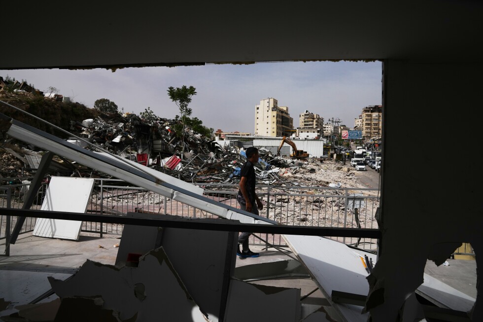 Israeli bulldozers raze Palestinian shops ahead of road project