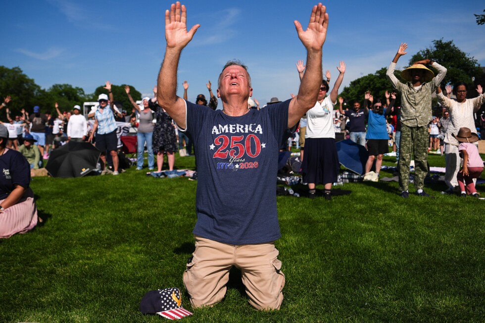 An America-themed prayer rally draws thousands to Washington's National Mall, in photos