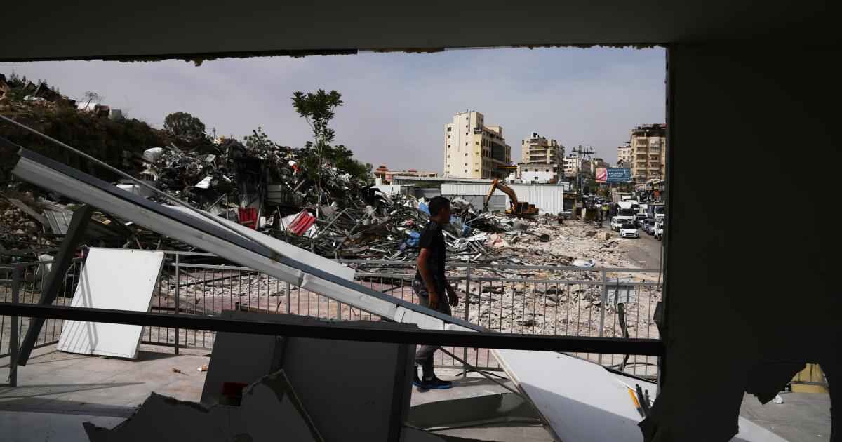 Israeli bulldozers raze about 50 Palestinian shops ahead of settlement-linked road project