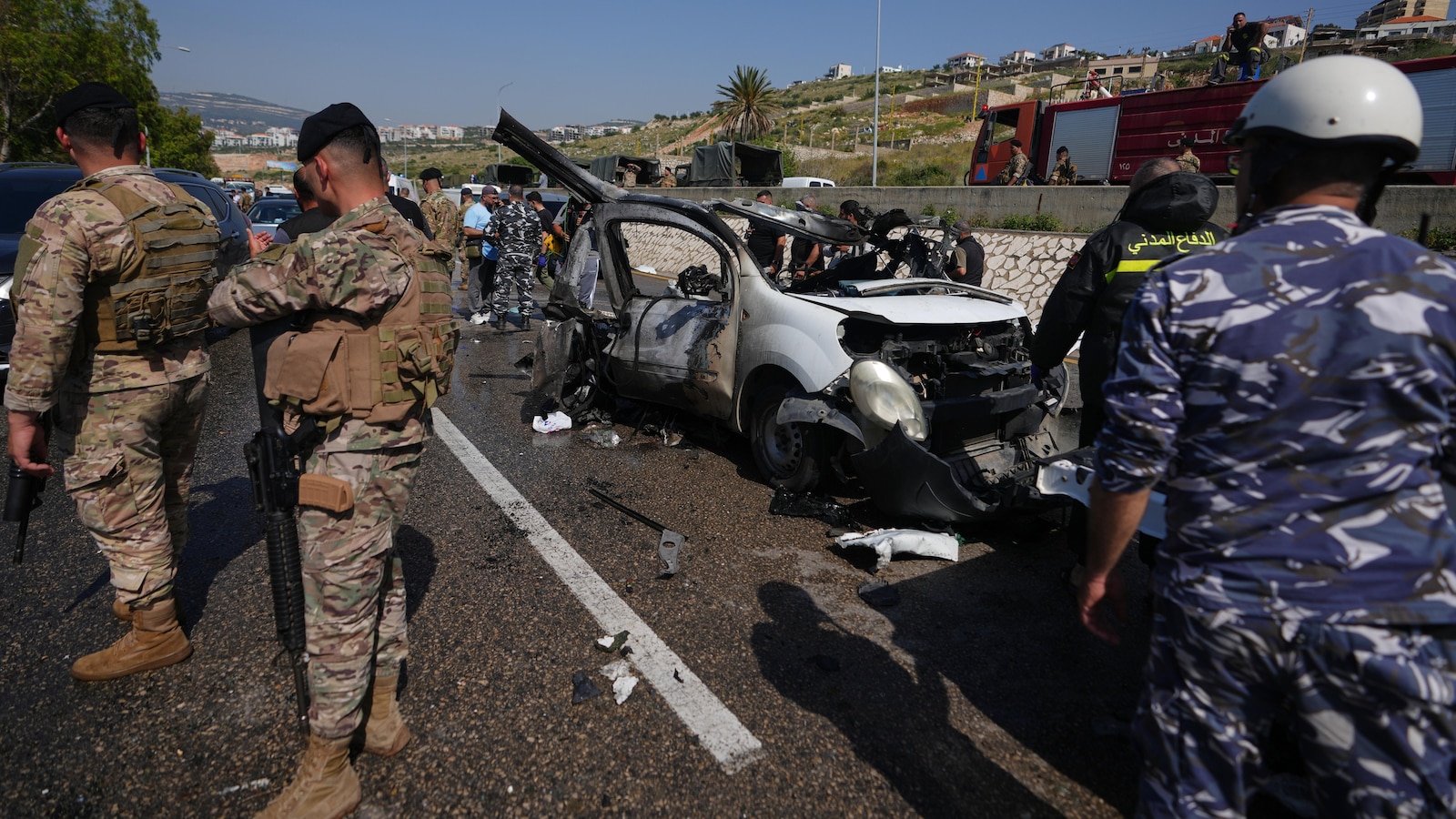 Israeli drone strikes near Beirut kill 4 and southern airstrikes kill at least 13