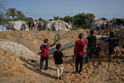 Palestinians inspect the destruction caused by an Israeli strike in Khan Younis, southern Gaza Strip, May. Credit: Abdel Kareem Hana/AP Palestinians inspect the destruction caused by an Israeli strike in Khan Younis, southern Gaza Strip, May.