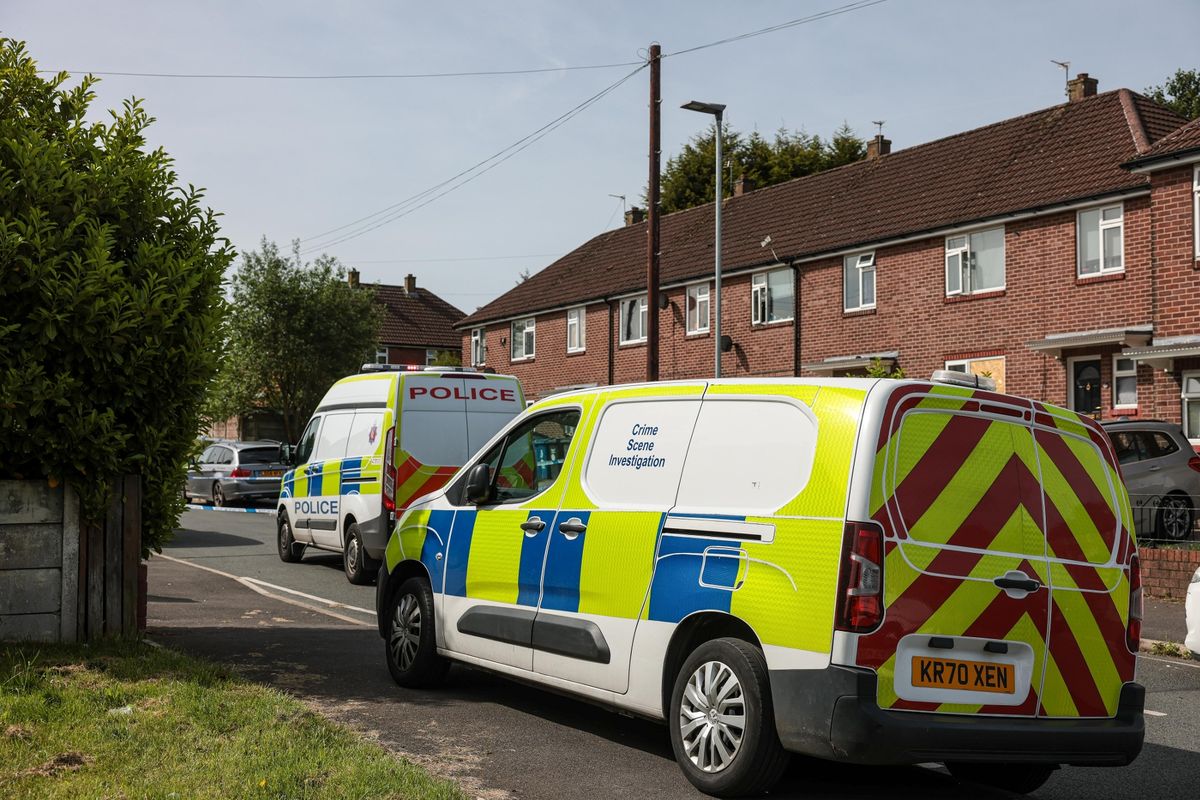 Police at the scene of the weekend's first serious stabbing, in Wigan