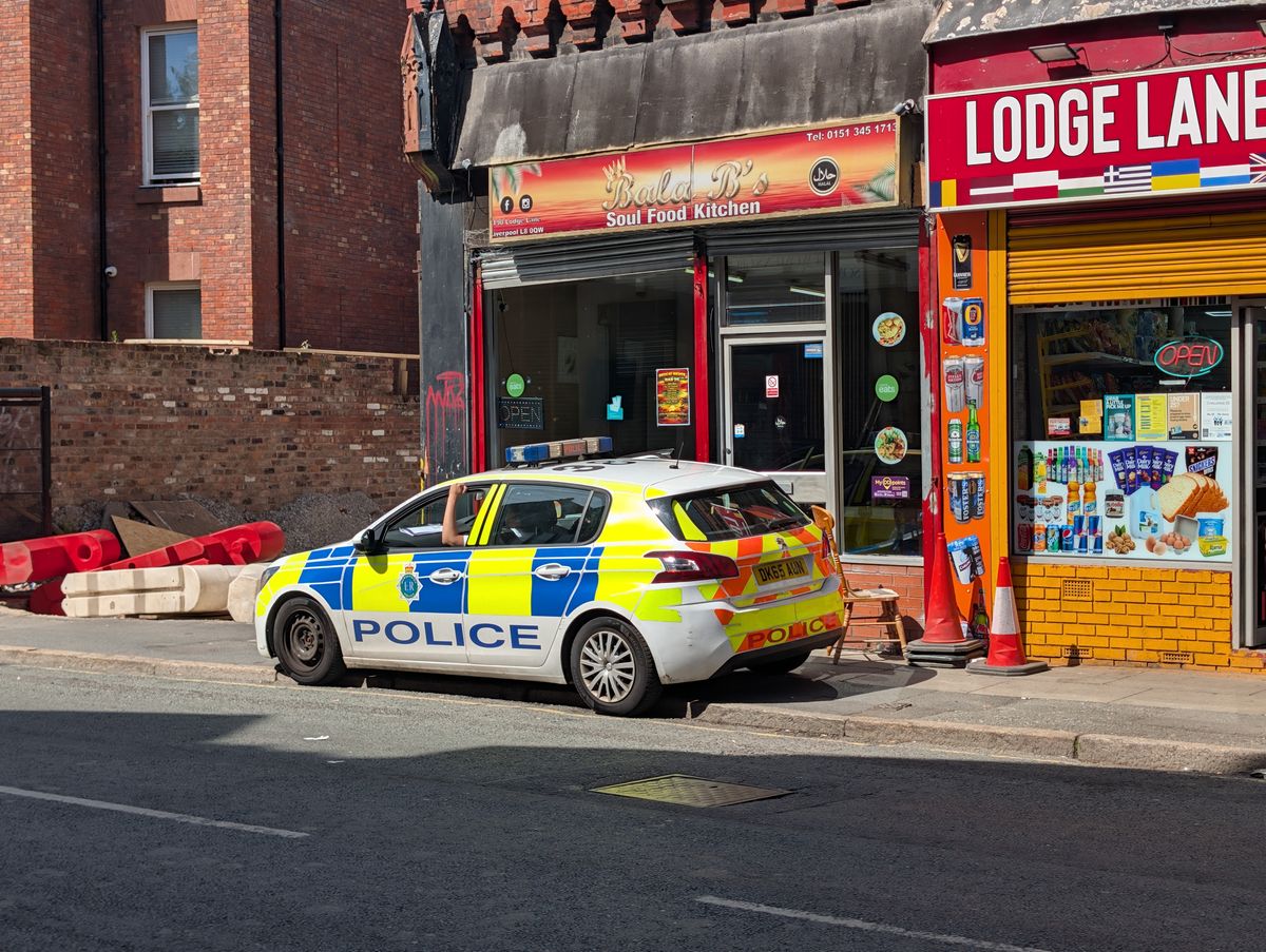 Merseyside Police outside Bala Bs on Lodge Lane following a shooting inside the cafe on Friday, June 19