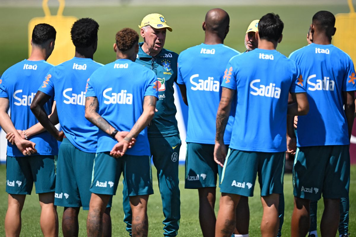 Brazil's Italian head coach Carlo Ancelotti (C) addresses his players