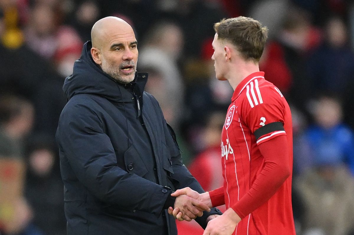 Pep Guardiola shakes hands with Elliot Anderson after Manchester City defeated Nottingham Forest at the City Ground