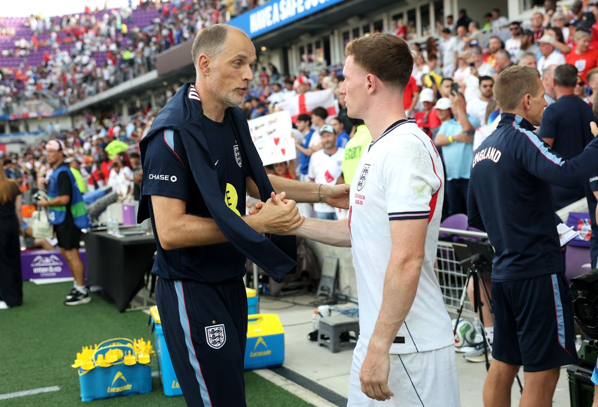 Thomas Tuchel, Manager of England, shakes hands with Elliot Anderson