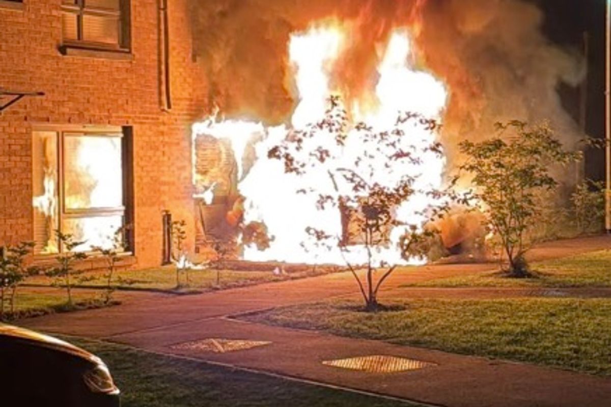 The car was rammed into the home before being torched