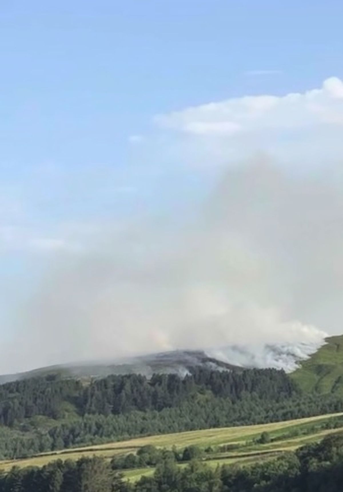 Smoke billowed into the air and blew over Greater Manchester
