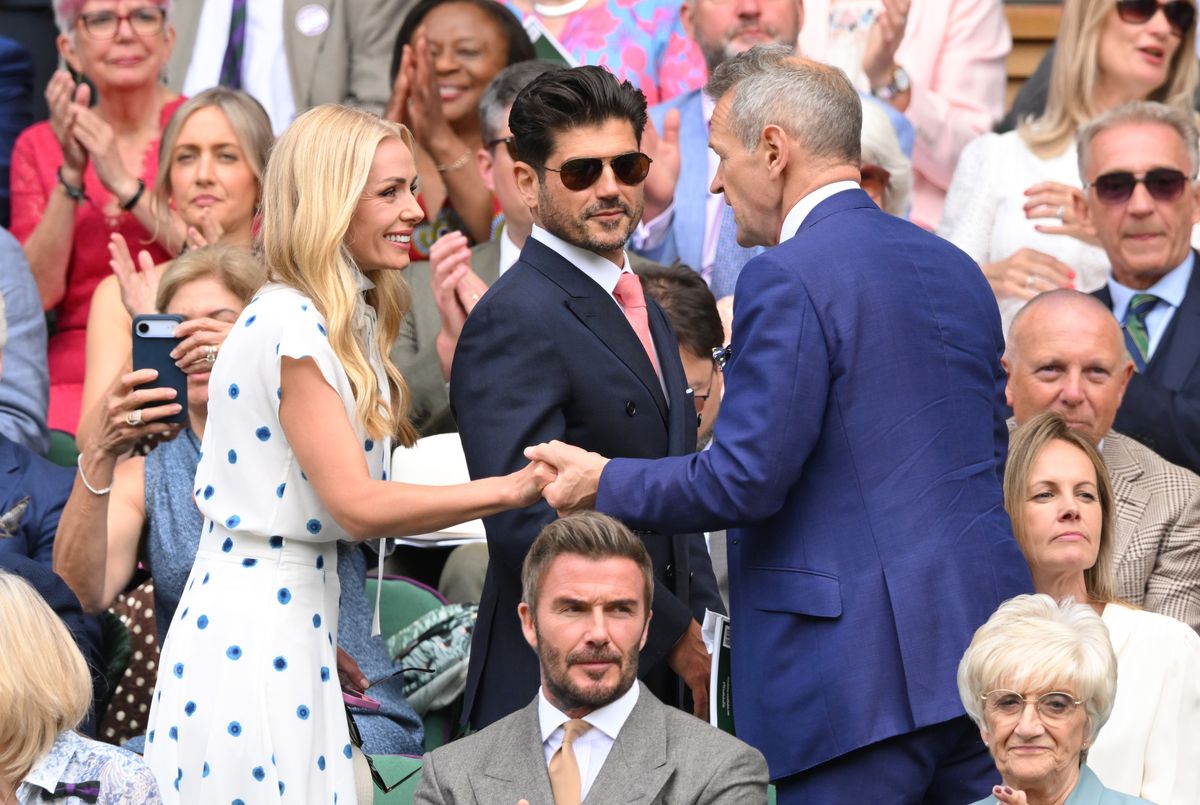 Katherine Jenkins and Andrew Levitas speak with Alexander Armstrong (R) with David Beckham sat just in front of them