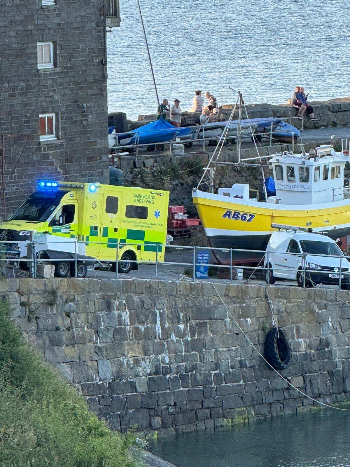 An ambulance parked at a harbour