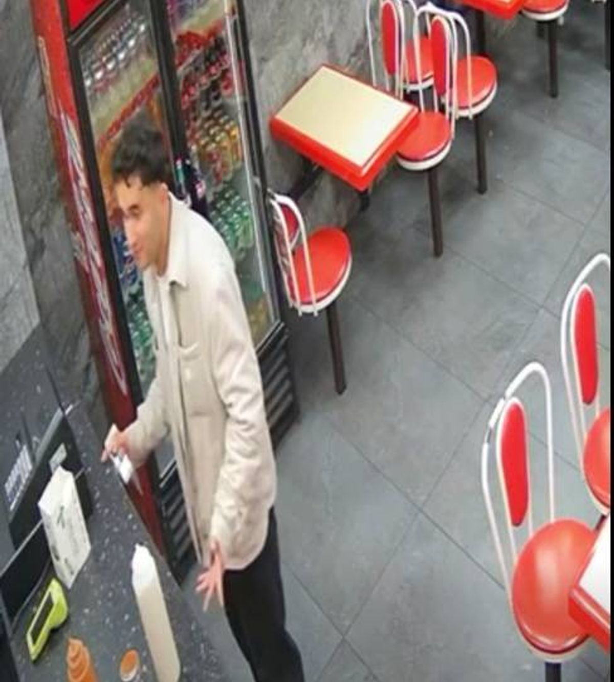 Sharam Muhamadi, 21, is wanted by police and was last seen in Birmingham - pictured here in a cafe or food outlet