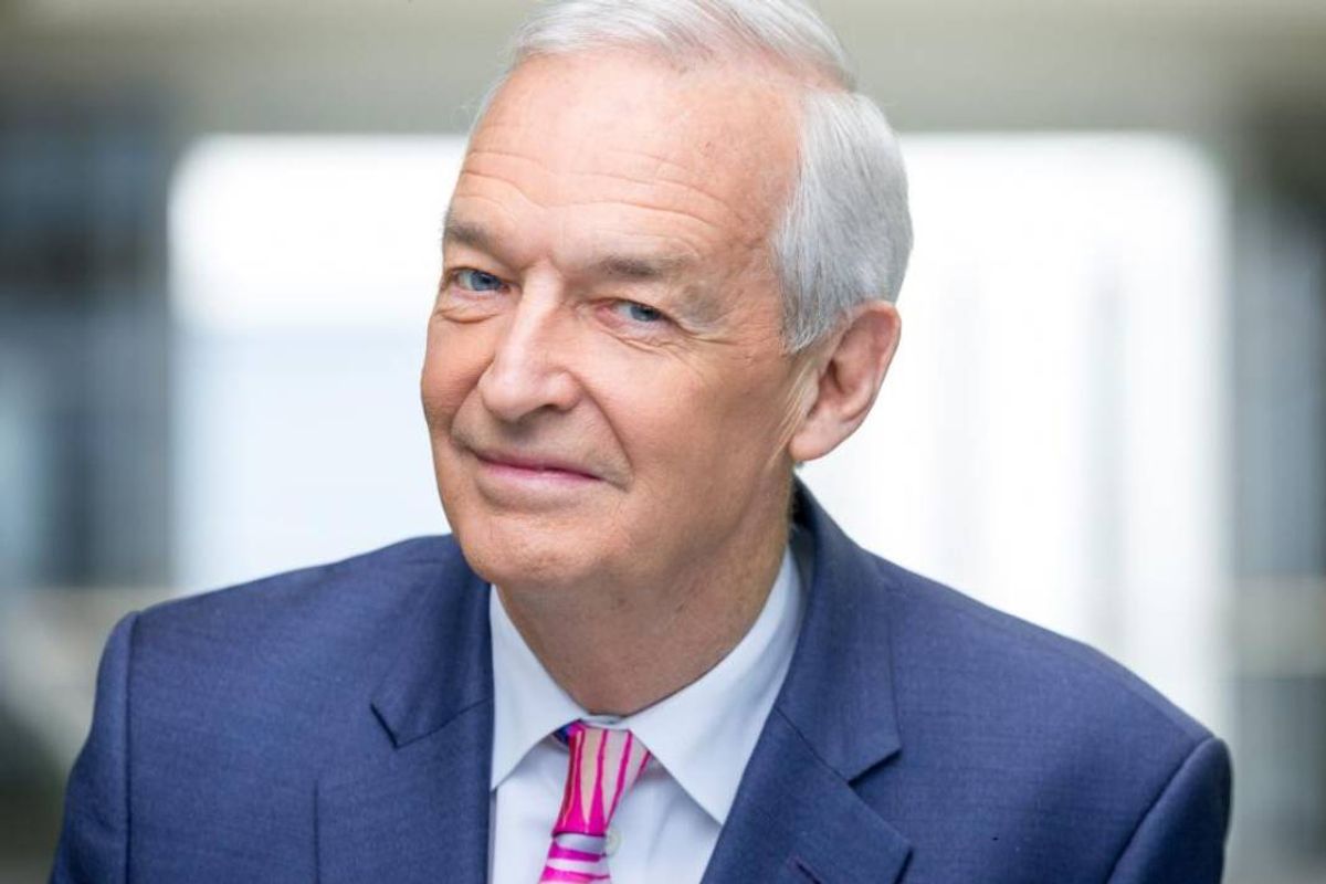 Grey haired man in blue blazer