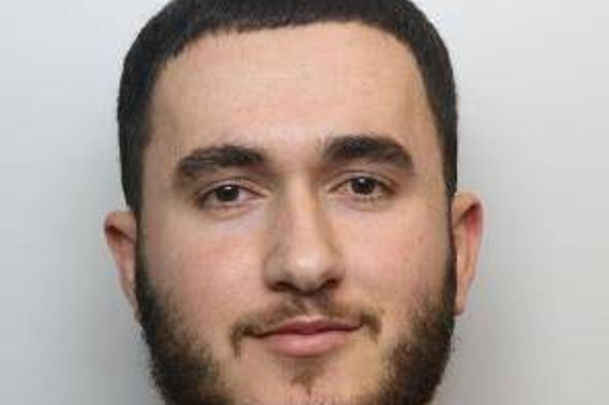 Police custody image of Sharam Muhamadi, 21, who is Asian with dark hair and a dark beard
