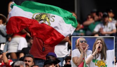 Iranian World Cup soccer fans wave pre-revolutionary flag inside stadium despite FIFA ban