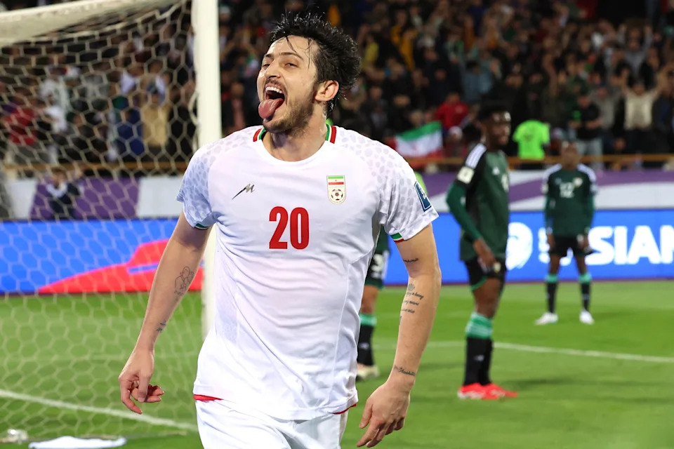 TOPSHOT - Iran's forward #20 Sardar Azmoun celebrates after scoring their first goal during the FIFA World Cup 2026 Asia zone qualifiers group A football match between Iran and the United Arab Emirates at the Azadi Sports Complex in Tehran on March 20, 2025. (Photo by AFP) (Photo by -/AFP via Getty Images)          