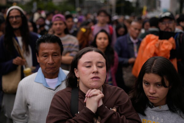 Supporters of presidential candidate Ivan Cepeda of the ruling Historic Pact coalition react as election results are announced in Bogota, Colombia, Sunday, May 31, 2026. (AP Photo/Matias Delacroix)