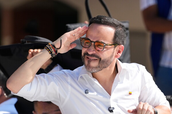 Presidential candidate Abelardo de la Espriella of the Defenders of the Motherland movement salutes after voting during the presidential election in Barranquilla, Colombia, Sunday, May 31, 2026. (AP Photo/Fernando Vergara)
