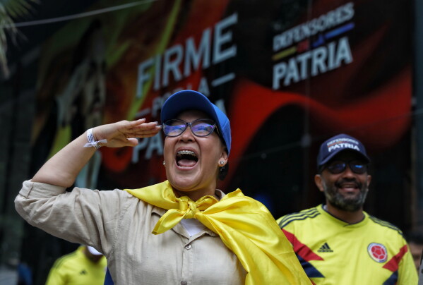 Supporters of presidential candidate Abelardo de la Espriella of the Defenders of the Motherland movement celebrate after the candidate advanced to a runoff election in Cali, Colombia, Sunday, May 31, 2026. (AP Photo/Santiago Saldarriaga)