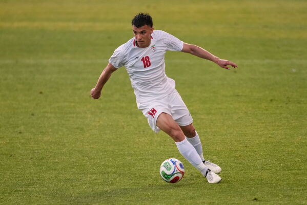 Iran's Amirhossein Hosseinzadeh plays the ball during a friendly soccer match between Iran and Gambia, in Antalya, southern Turkey, Friday, May 29, 2026. (AP Photo/Khalil Hamra)