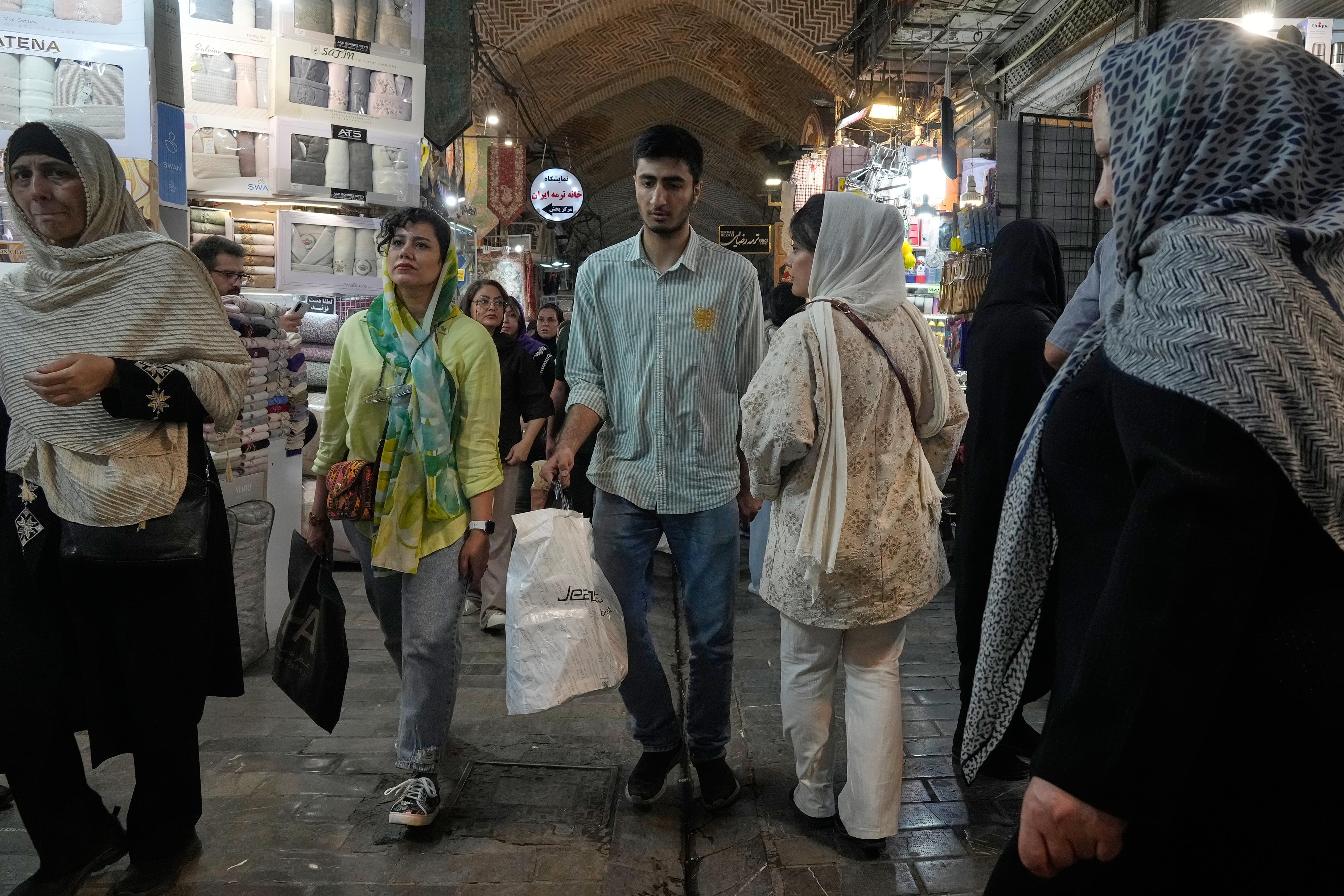 People walk at Tehran's historic Grand Bazaar, Iran.