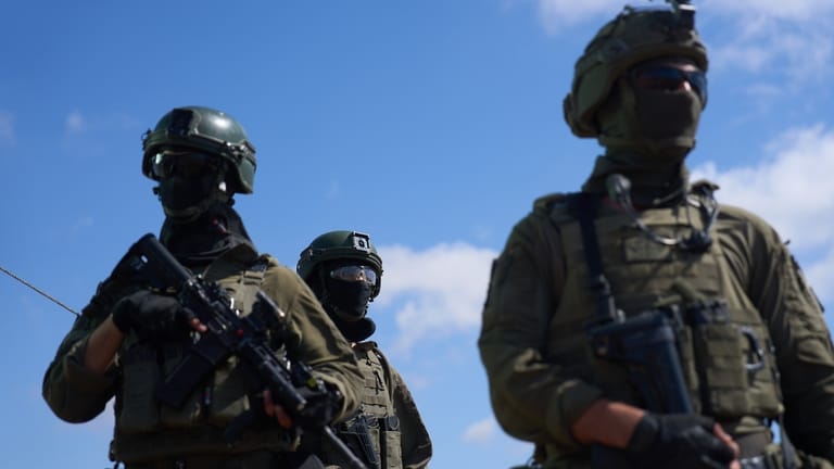 Israeli soldiers occupy a military position overlooking the so-called Yellow...